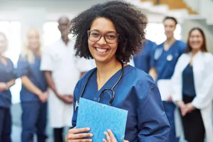 Nurse celebrating completion of an online nursing degree program with colleagues