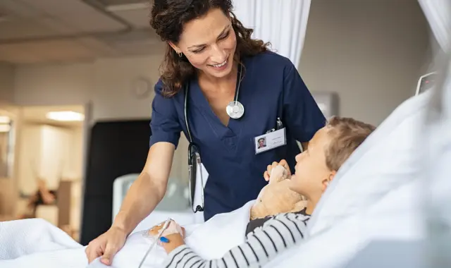 Smiling nurse taking care of a patient